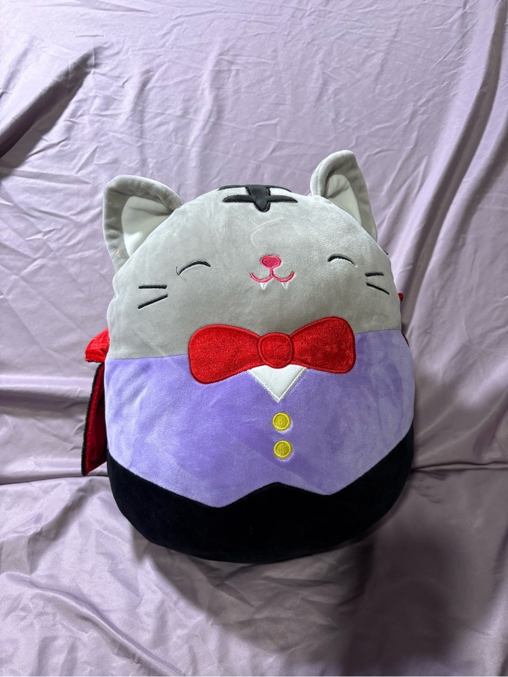 Squishmallows Gray Cat Plush with Red Bow and Purple Vest